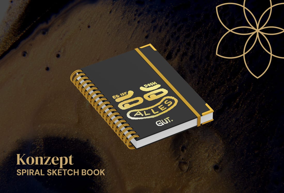Konzept-Mockup: Spiralblock mit Gold-Handlettering "Es ist doch alles gut." und dem Vesica-Logo